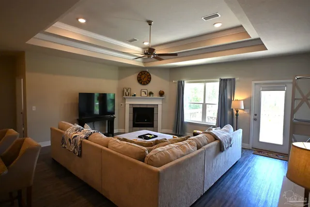 a living room with furniture and a fireplace