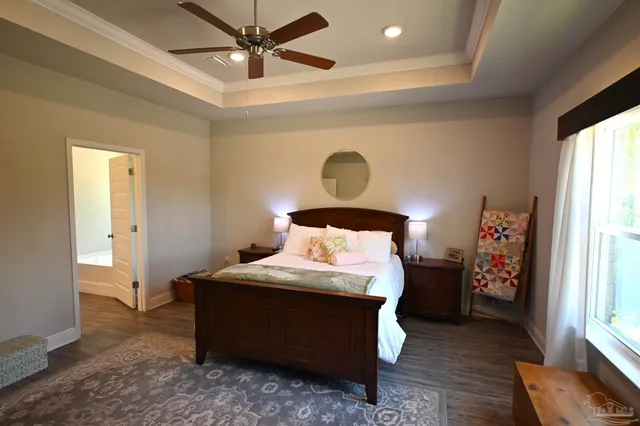 a bedroom with a bed and window