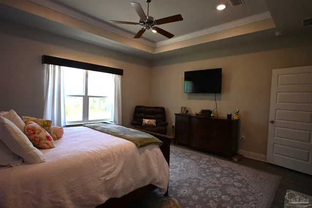 a bathroom with double vanity and a mirror