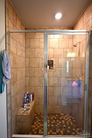 a bathroom with a tub and a window