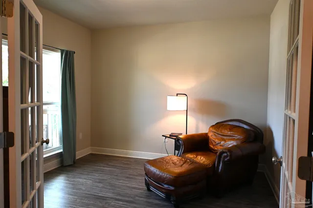 a bedroom with a bed and a couch
