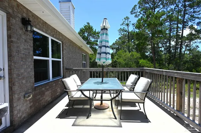 a view of a balcony with furniture