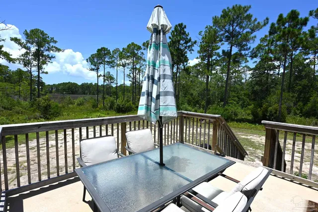 a view of a balcony with furniture