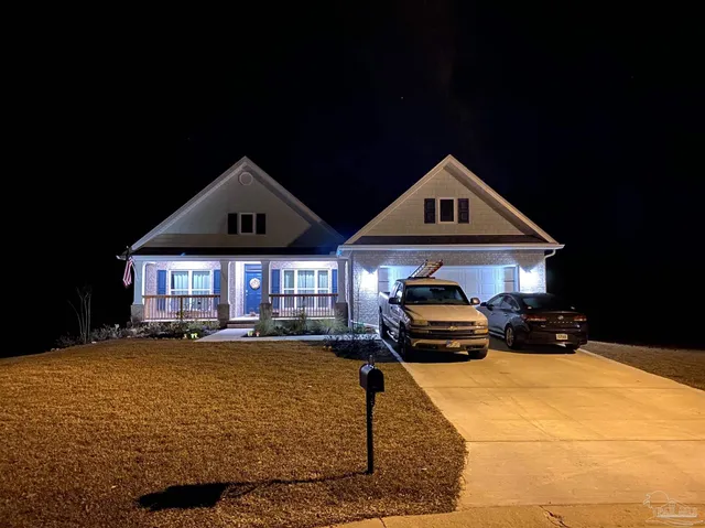 a view of a house with garden and a garden