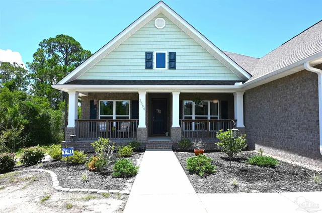 a view of a balcony with chair and table