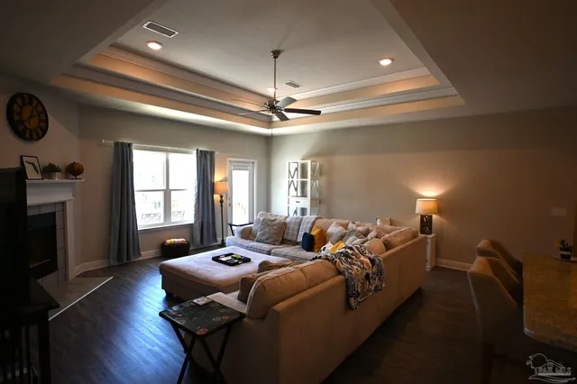 a living room with furniture fireplace and flat screen tv