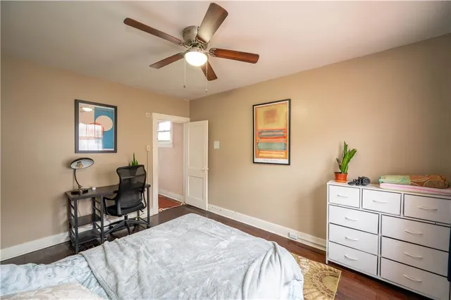 a bedroom that has a bed and a chair in it