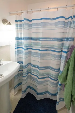 a bathroom with a sink and a shower