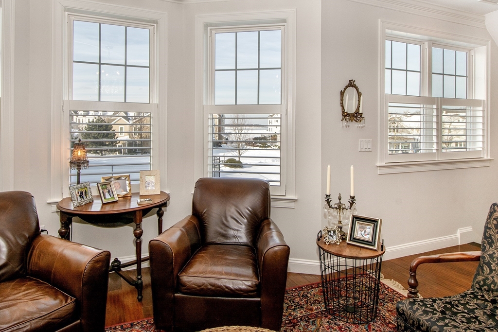 151 HMS Stayner Drive, Unit 151 Hingham, MA 02043 - Photo 12 of 42 a living room with furniture and a window