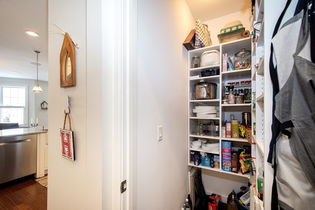 151 HMS Stayner Drive, Unit 151 Hingham, MA 02043 - Photo 20 of 42 a view of walk in closet with clothes and shoes