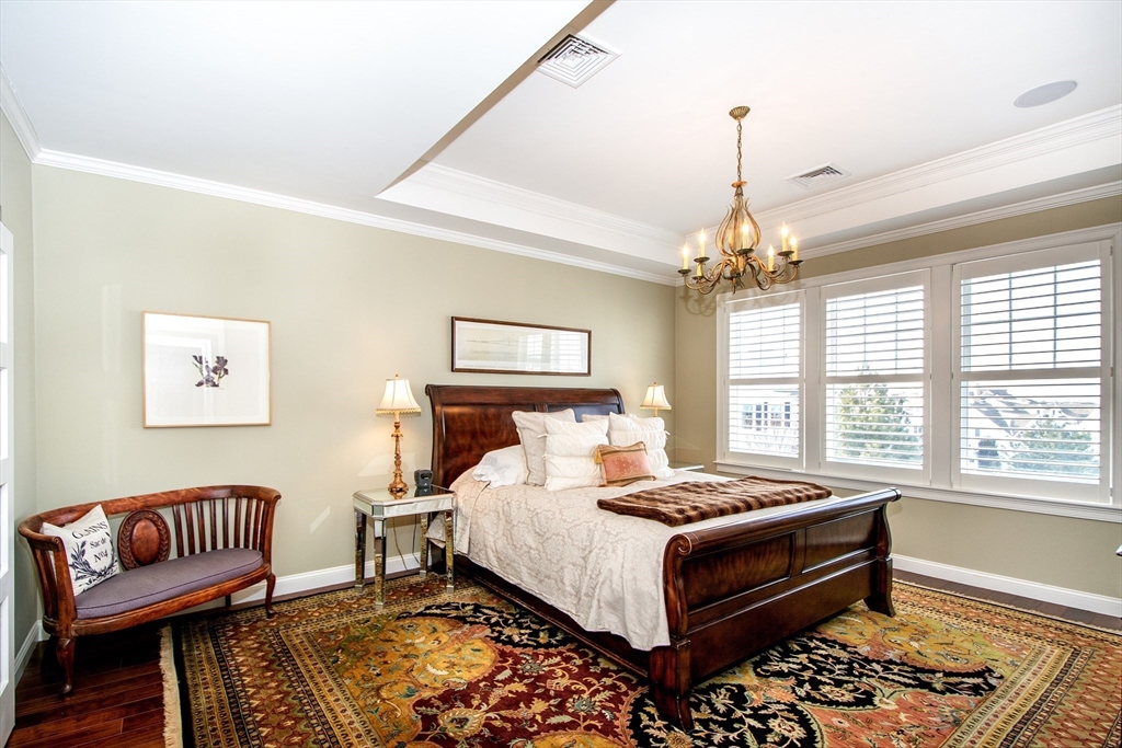 151 HMS Stayner Drive, Unit 151 Hingham, MA 02043 - Photo 31 of 42 a bedroom with a bed and a window