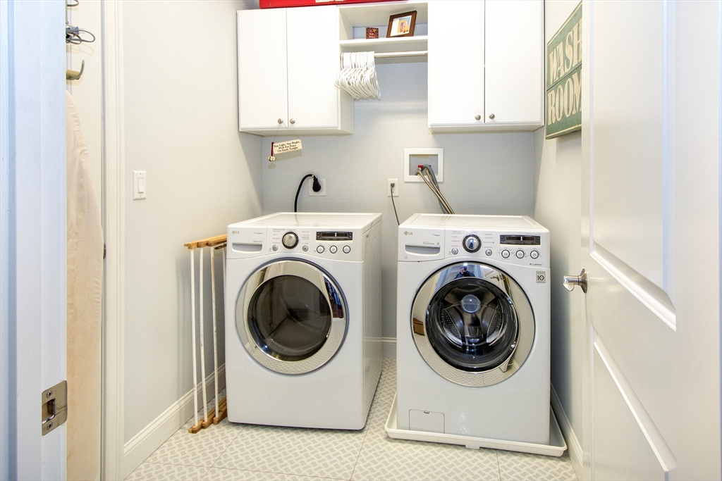 151 HMS Stayner Drive, Unit 151 Hingham, MA 02043 - Photo 40 of 42 a utility room with dryer and washer
