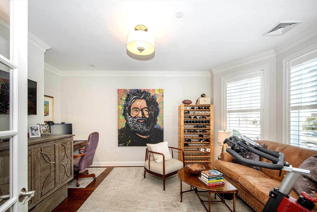 151 HMS Stayner Drive, Unit 151 Hingham, MA 02043 - Photo 6 of 42 a living room with furniture and wooden floor