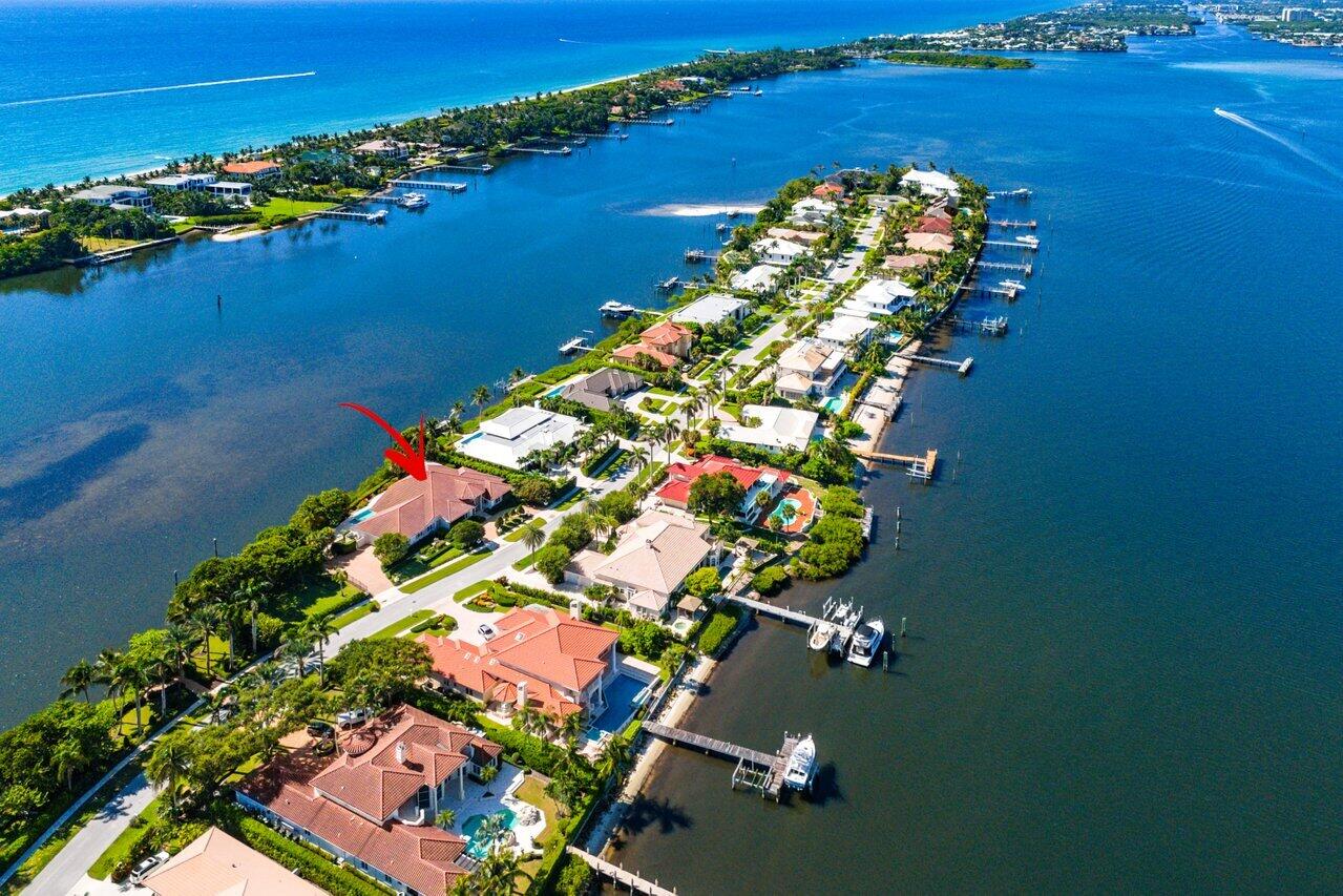 1620 Lands End Road Manalapan, FL 33462 - Photo 2 of 34 an aerial view of a house with a lake view