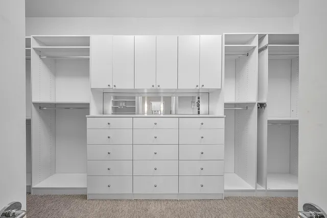 a bedroom with bed and window