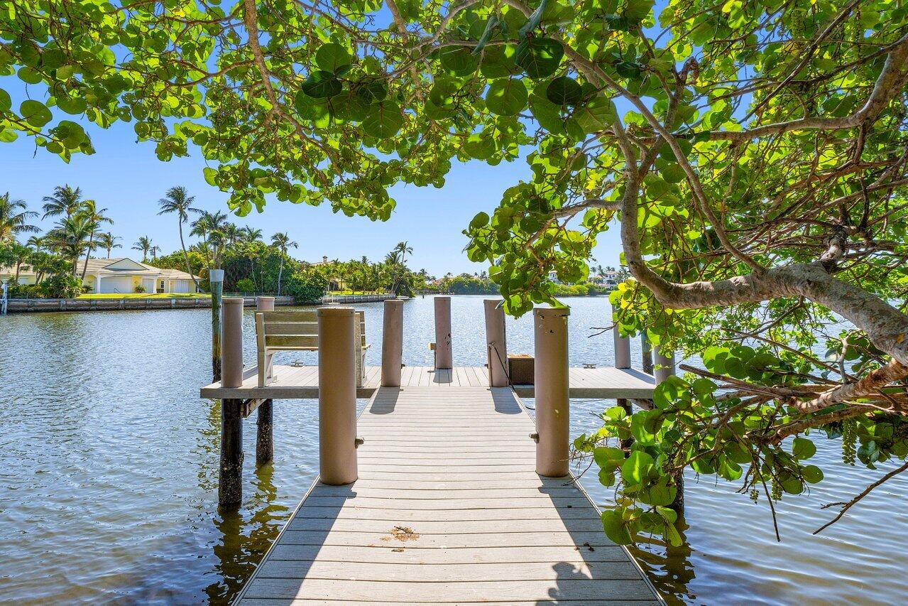 1620 Lands End Road Manalapan, FL 33462 - Photo 32 of 34 a wooden bridge near a lake