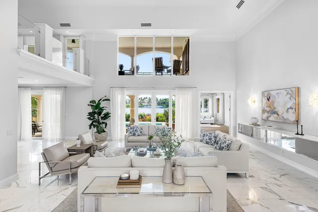 a living room with fireplace furniture and decor