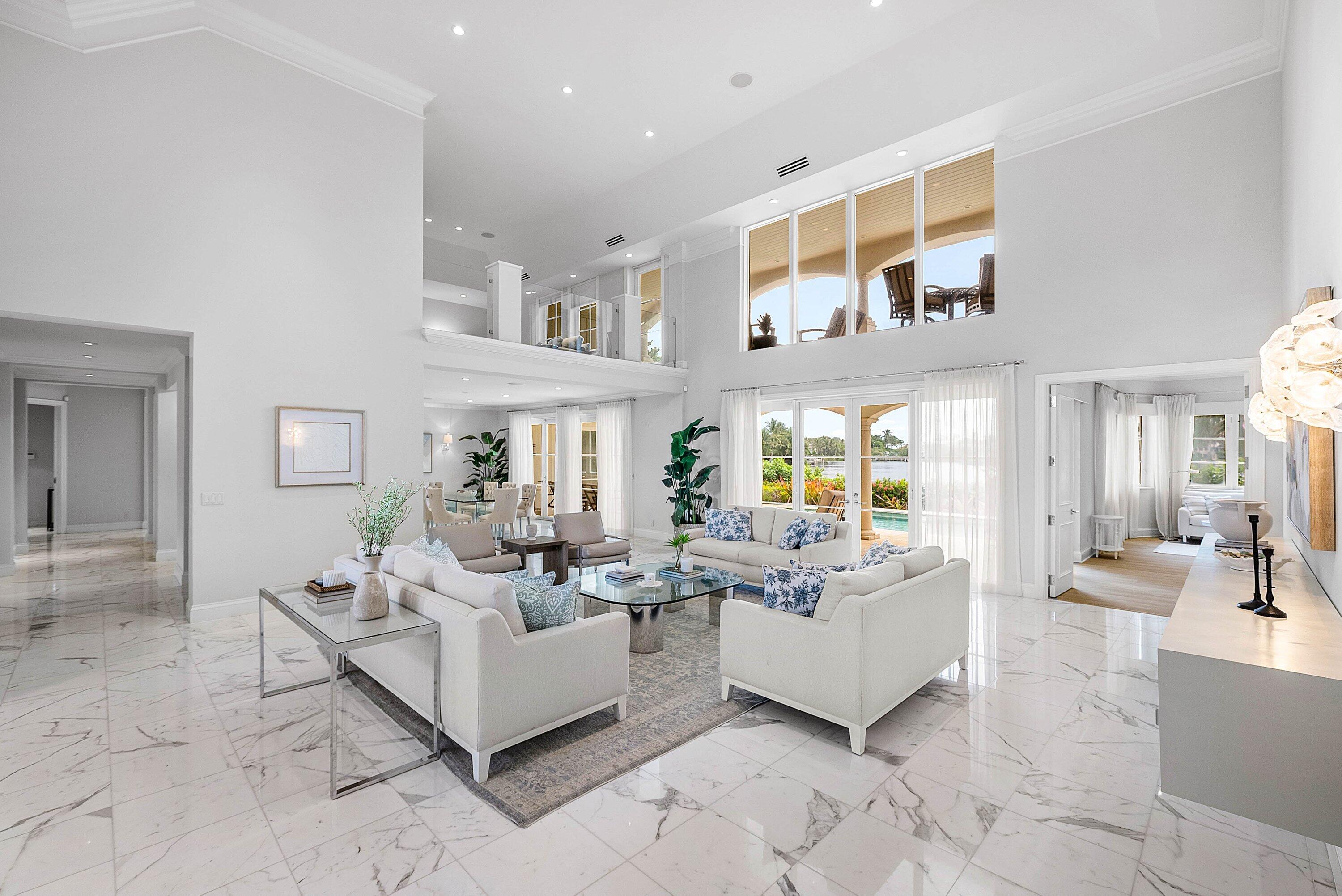 1620 Lands End Road Manalapan, FL 33462 - Photo 6 of 34 a living room with furniture and a large window