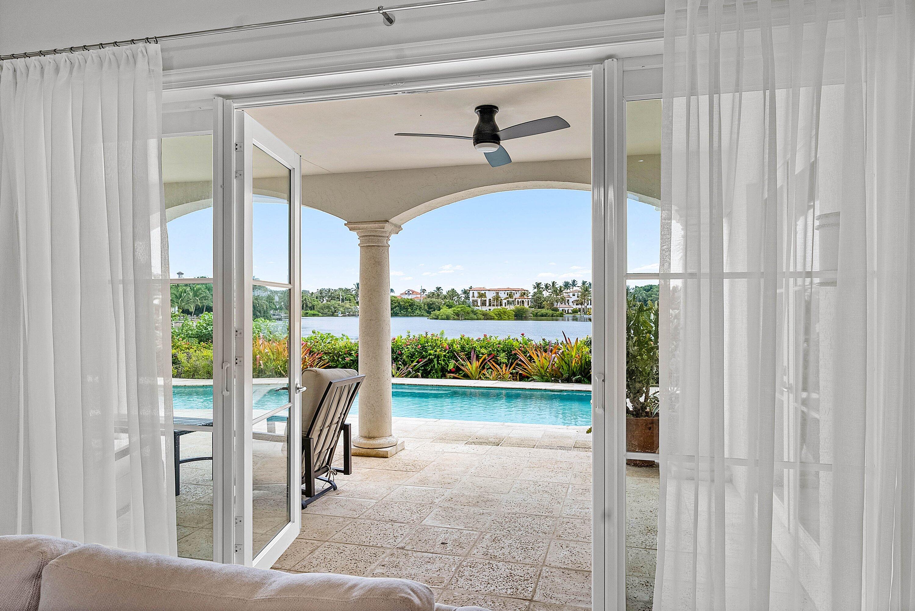 1620 Lands End Road Manalapan, FL 33462 - Photo 9 of 34 a view of a floor to ceiling window and a porch