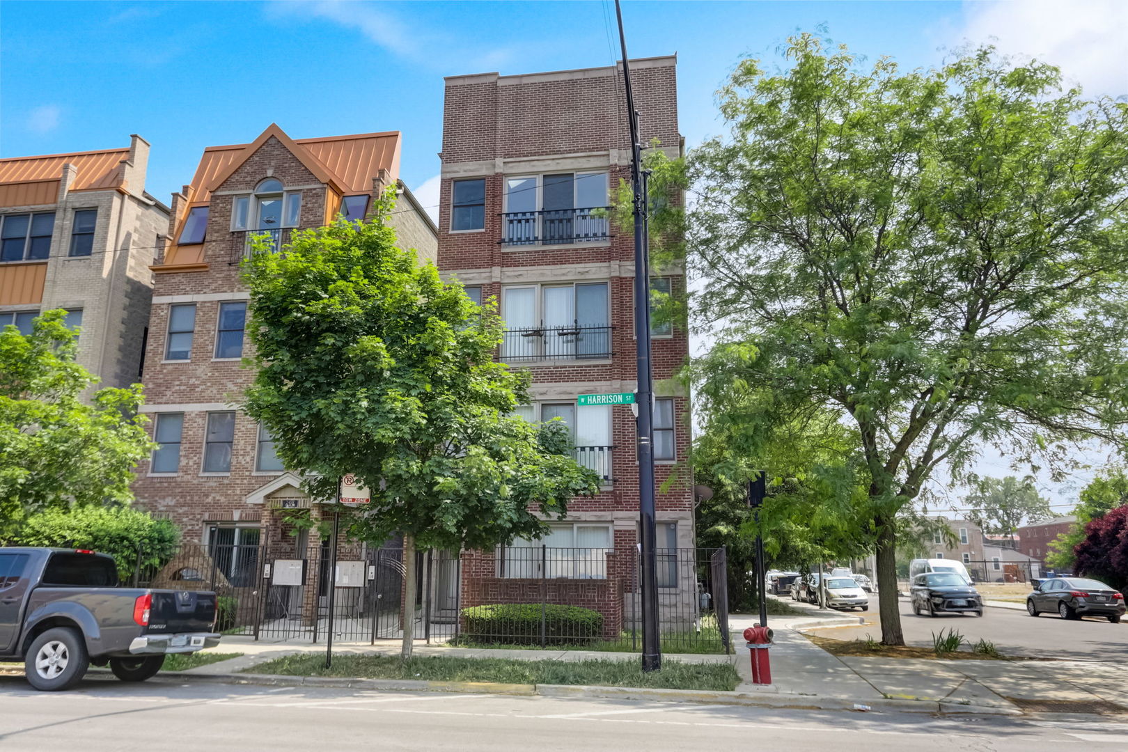 2457 West Harrison Street, Unit 3 Chicago, IL 60612 - Photo 1 of 20 a view of a car parked in front of a building