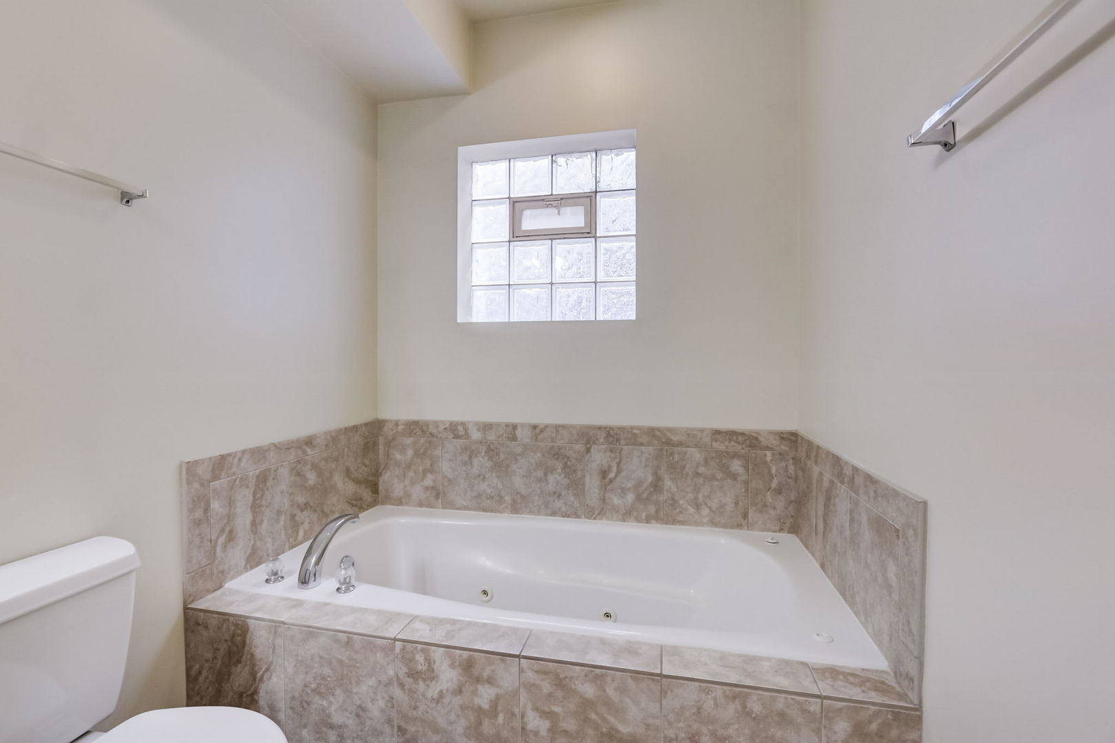 2457 West Harrison Street, Unit 3 Chicago, IL 60612 - Photo 11 of 20 a bathroom with a bathtub and toilet