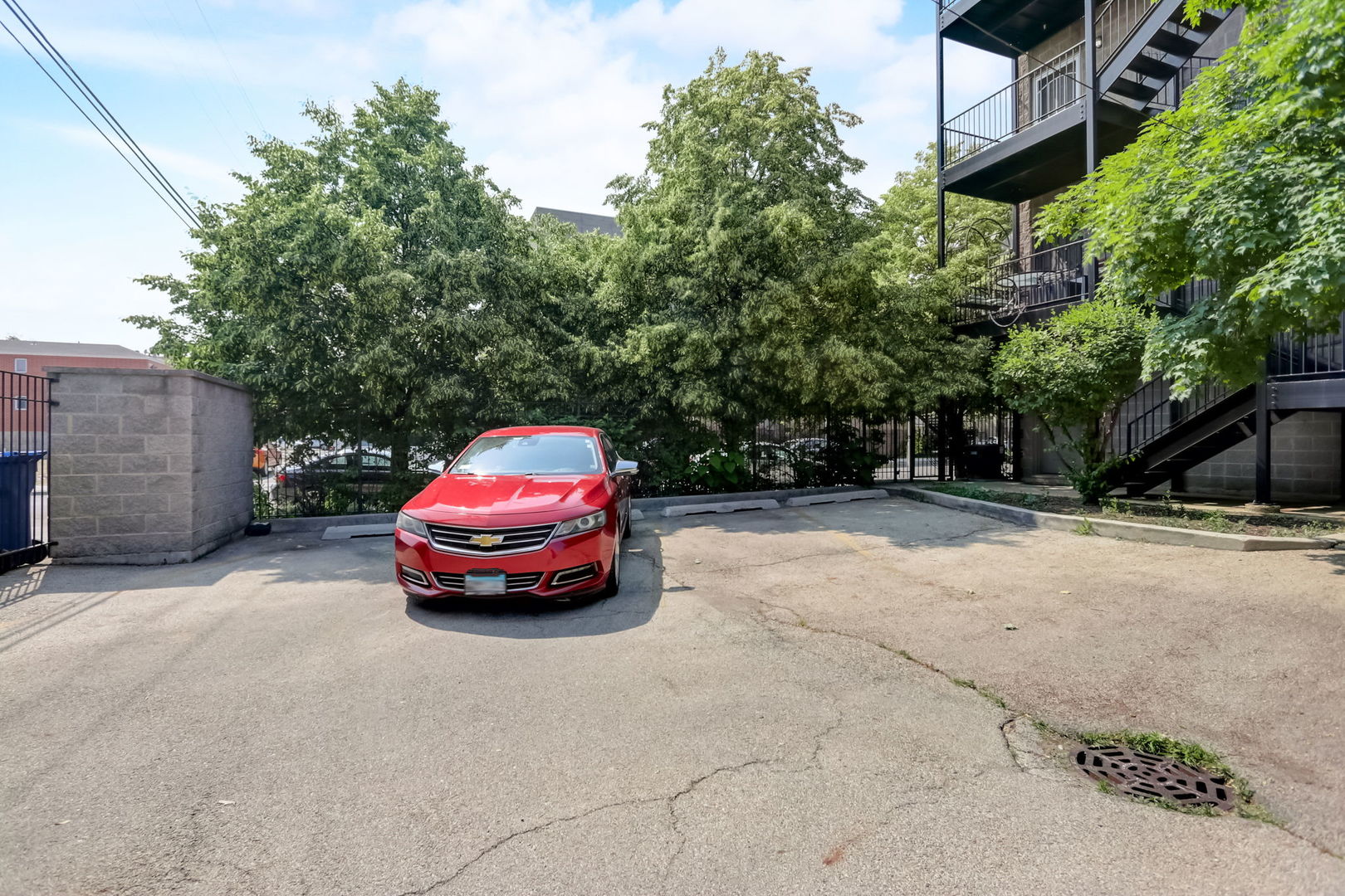 2457 West Harrison Street, Unit 3 Chicago, IL 60612 - Photo 19 of 20 a car parked in front of a white house
