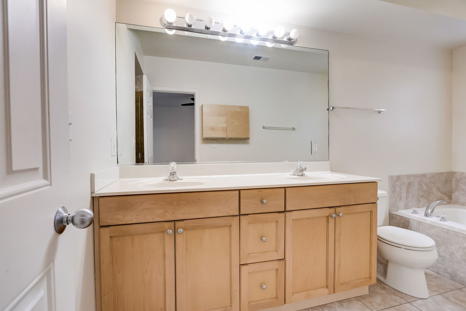 2457 West Harrison Street, Unit 3 Chicago, IL 60612 - Photo 10 of 20 a bathroom with a toilet sink and mirror