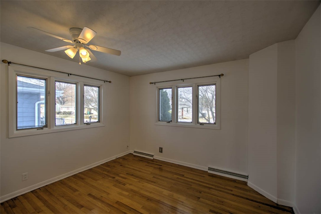 155 Columbus Drive Decatur, IL 62526 - Photo 14 of 30 a view of an empty room with window and chandelier fan