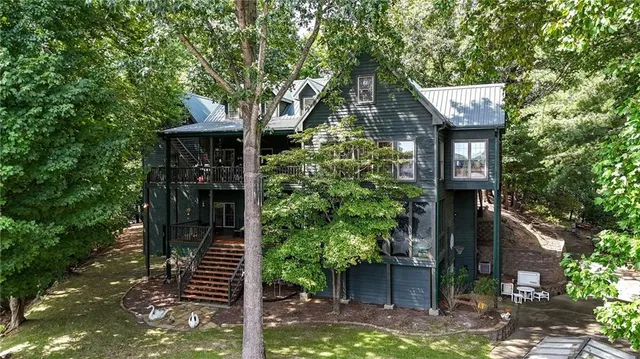 a view of outdoor space with deck and trees
