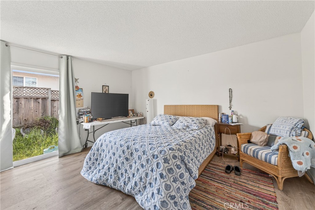 1688 Harding Street Seaside, CA 93955 - Photo 18 of 37 a bedroom with bed and large window