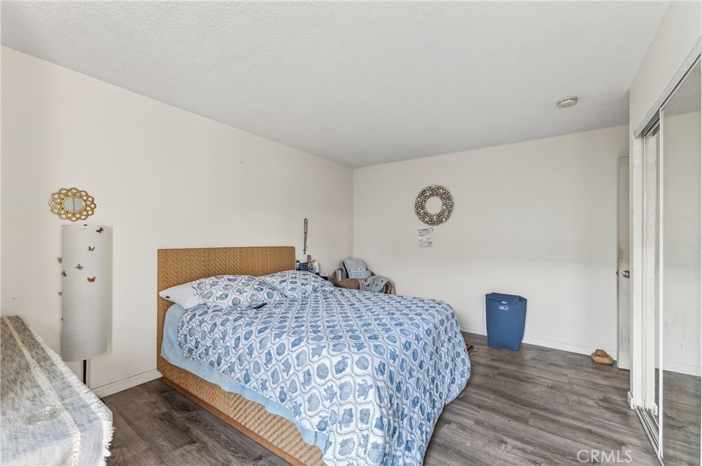 1688 Harding Street Seaside, CA 93955 - Photo 21 of 37 a bedroom with a bed and a lamp on dresser