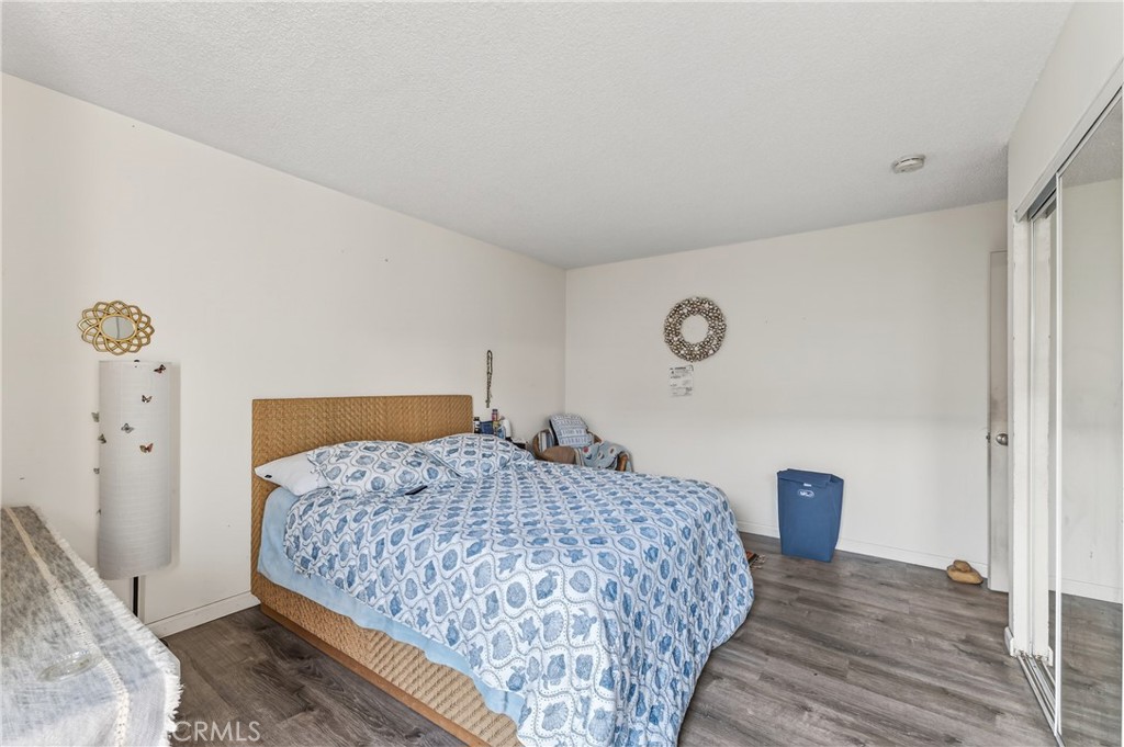 1688 Harding Street Seaside, CA 93955 - Photo 21 of 37 a bedroom with a bed and a lamp on dresser