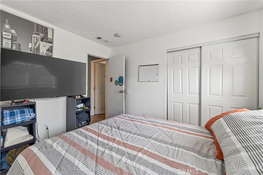 1688 Harding Street Seaside, CA 93955 - Photo 26 of 37 a bedroom with a bed and a television