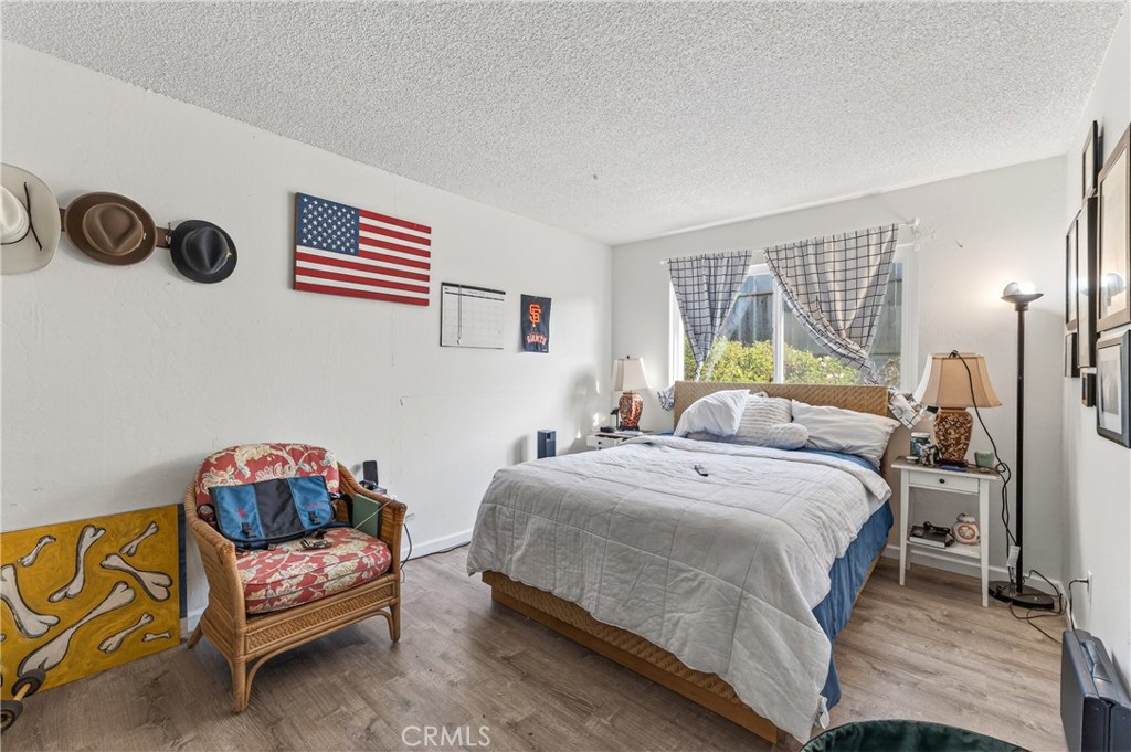 1688 Harding Street Seaside, CA 93955 - Photo 27 of 37 a bedroom with a bed and a couch