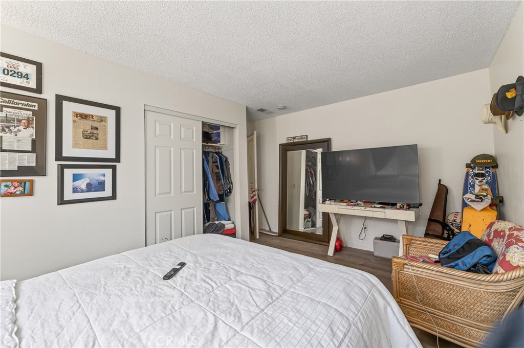 1688 Harding Street Seaside, CA 93955 - Photo 28 of 37 a bedroom with a bed and a flat screen tv