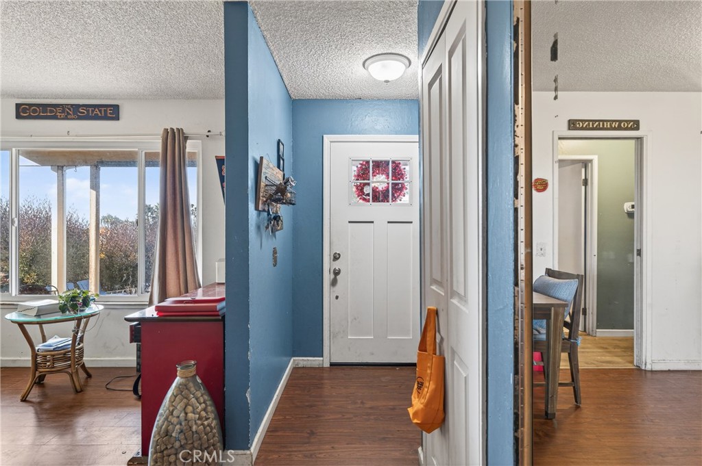 1688 Harding Street Seaside, CA 93955 - Photo 4 of 37 a view of a hallway with wooden floor and windows