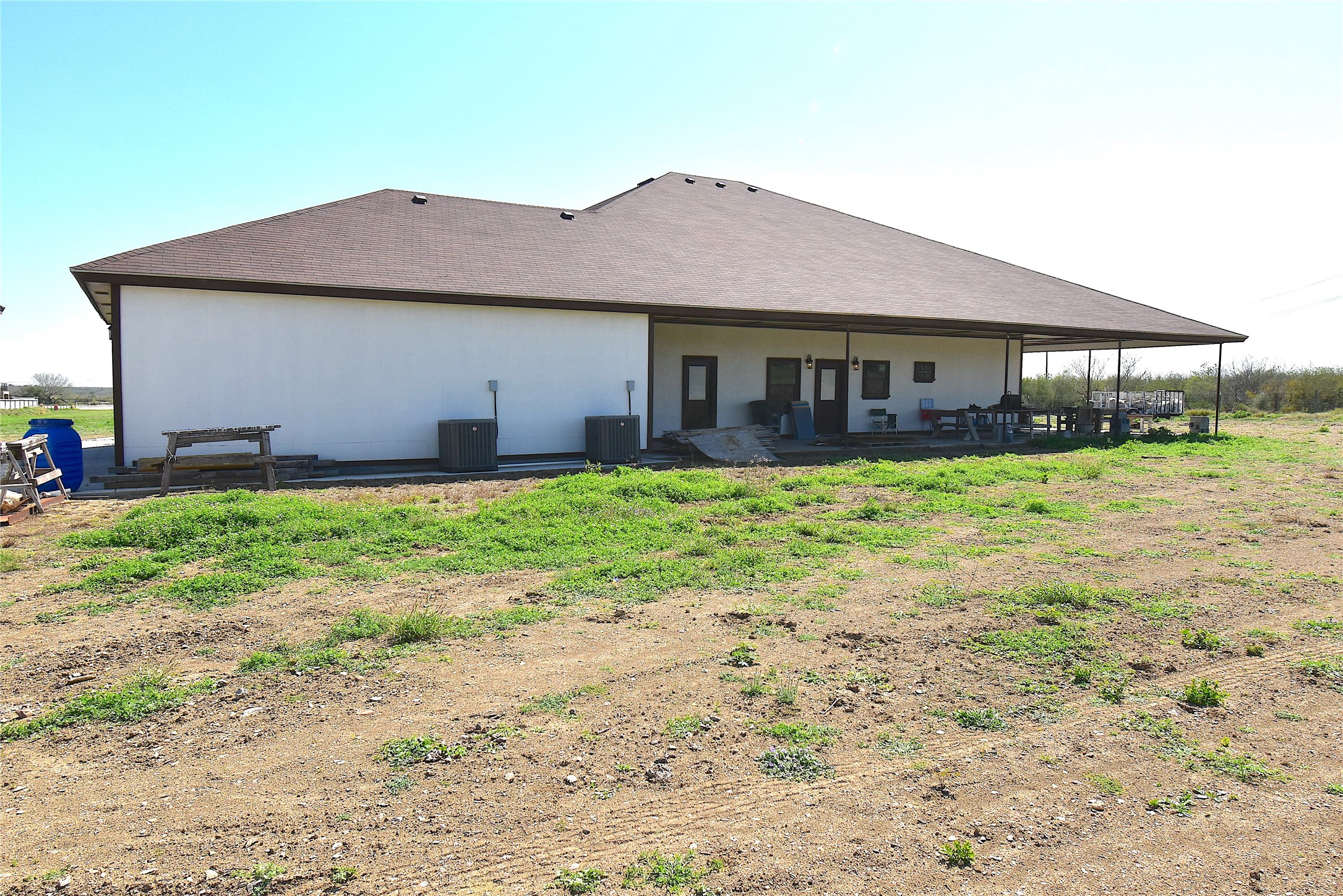2991 Highway 83 Roma, TX 78584 - Photo 2 of 42 a front view of a house with a yard and garage