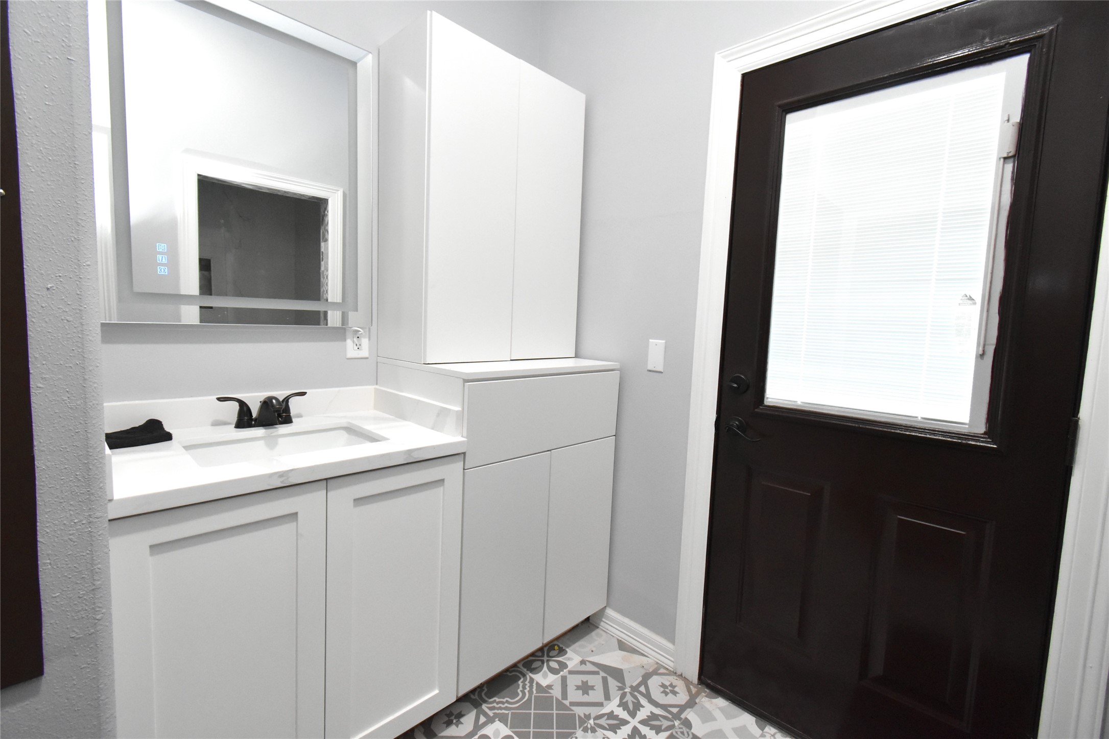 2991 Highway 83 Roma, TX 78584 - Photo 24 of 42 a bathroom with a sink and a mirror
