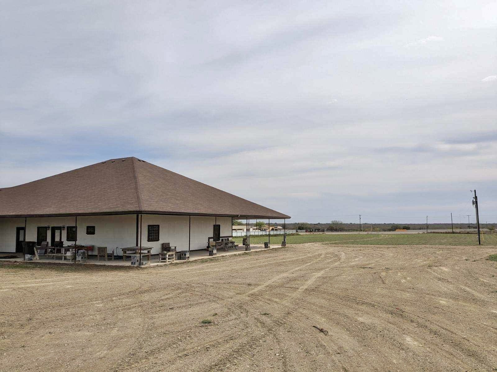 2991 Highway 83 Roma, TX 78584 - Photo 35 of 42 a house with swimming pool in front of it