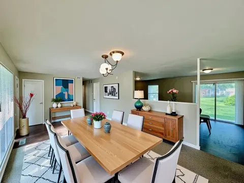 a view of a dining room with furniture window and wooden floor