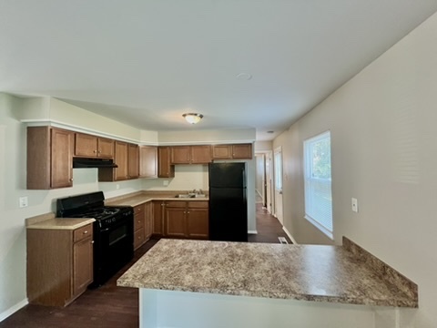 829 Princeton Avenue Matteson, IL 60443 - Photo 7 of 20 a kitchen with stainless steel appliances granite countertop a refrigerator a stove top oven a sink and dishwasher