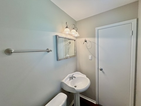 829 Princeton Avenue Matteson, IL 60443 - Photo 10 of 20 a bathroom with a toilet a sink and mirror