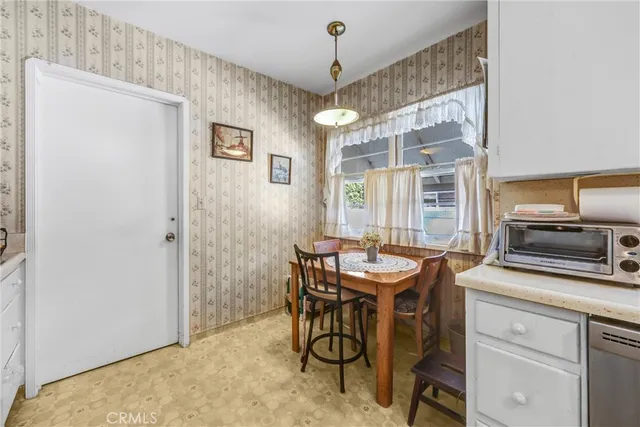 a dining room with a granite table and chairs