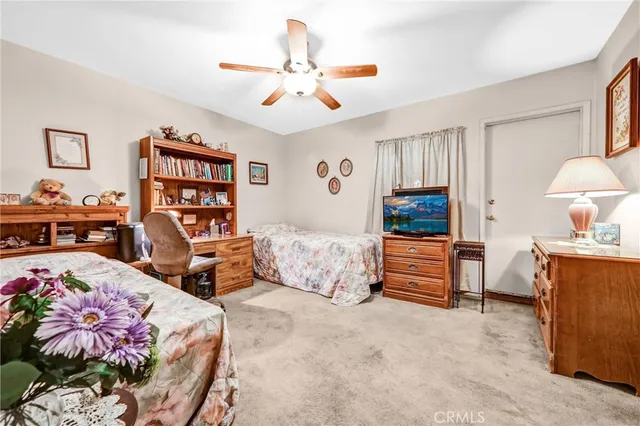 a bedroom with furniture and a bed