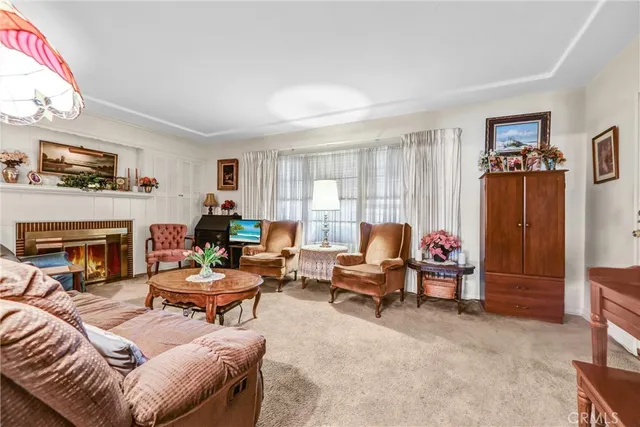 a living room with furniture fireplace and a flat screen tv