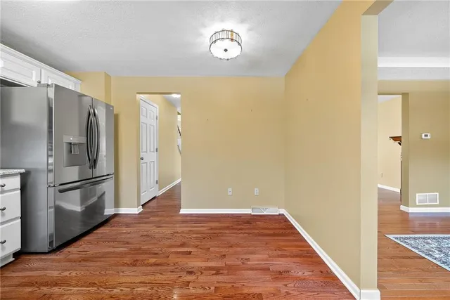 a view of a kitchen with a refrigerator a sink and dishwasher