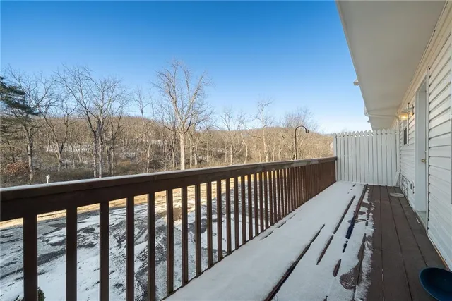 a view of balcony with wooden floor