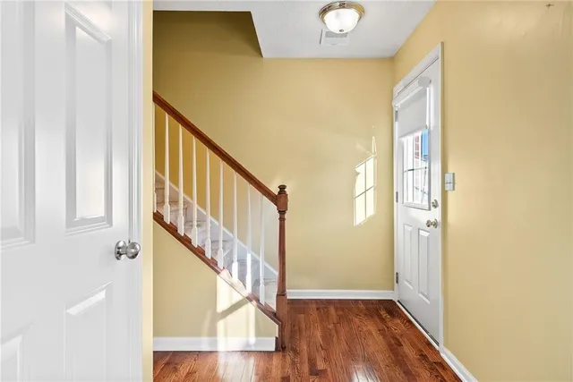 a view of front door with wooden floor