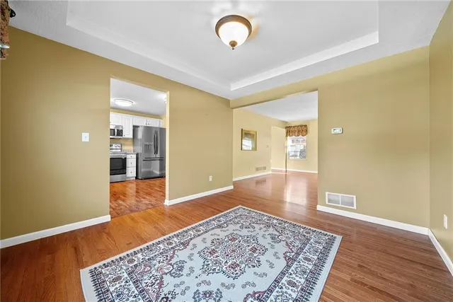 wooden floor with a window in a room