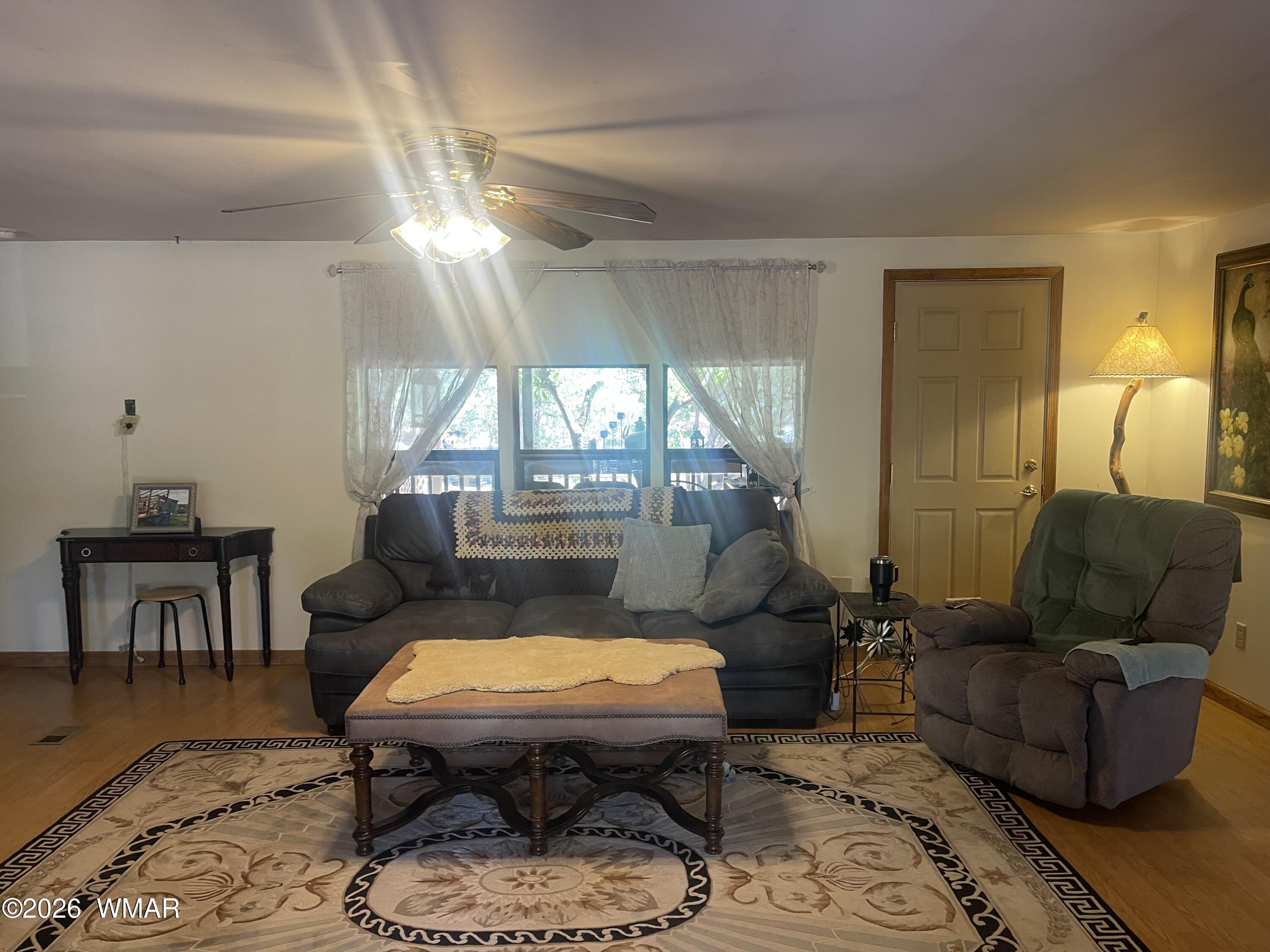 2871 Moose Trail Overgaard, AZ 85933 - Photo 5 of 25 a living room with furniture and a fireplace